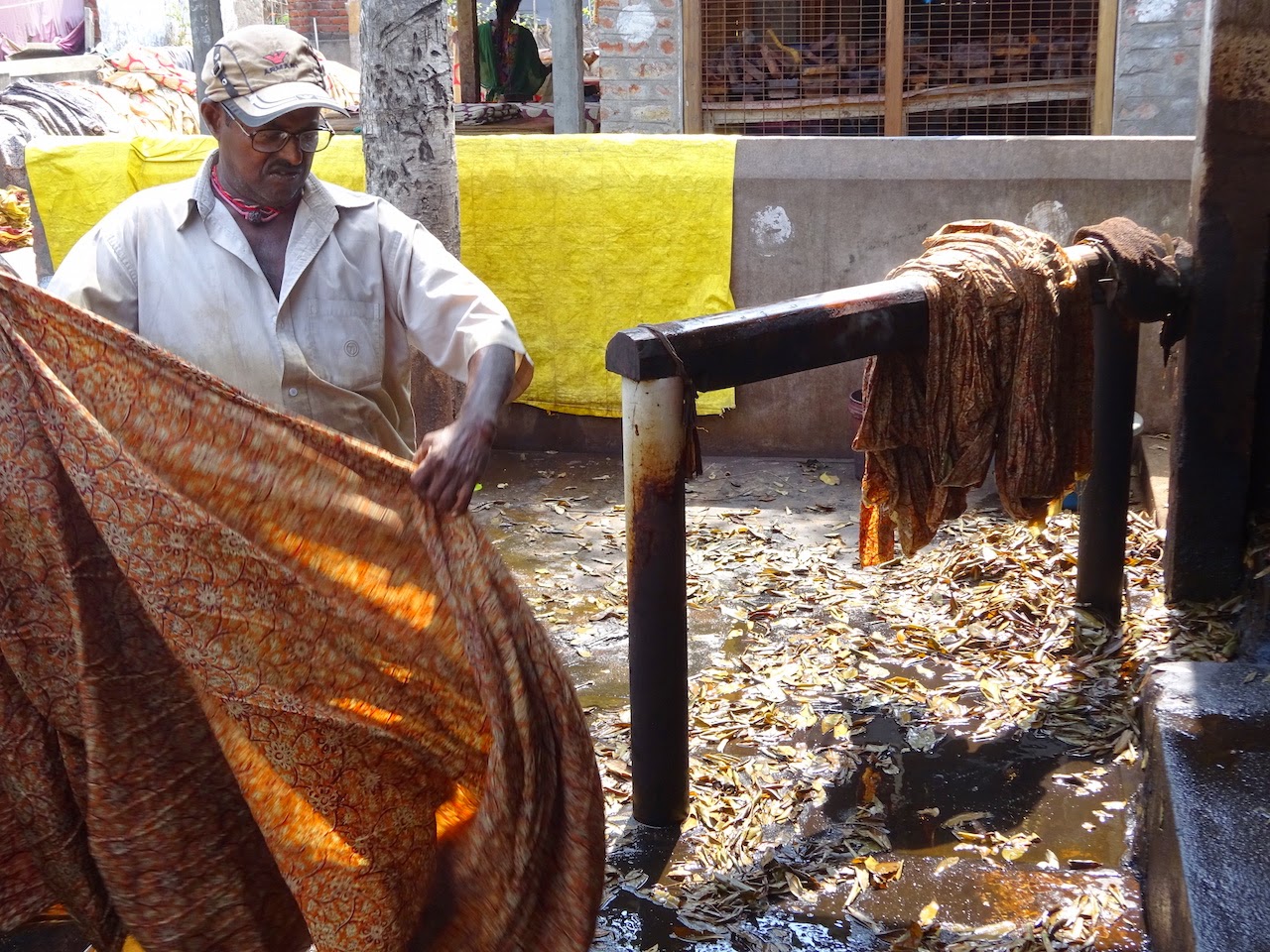Printed Kalamkari cloth being washed during the Pedana process