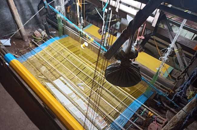 Wooden handloom and threads in a Mangalagiri workshop
